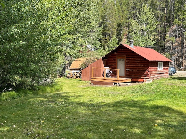 view of outdoor structure featuring a forest view