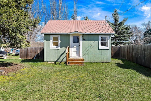 view of outbuilding with an outdoor structure and a fenced backyard