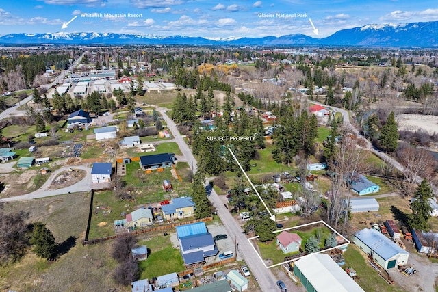 birds eye view of property with a mountain view