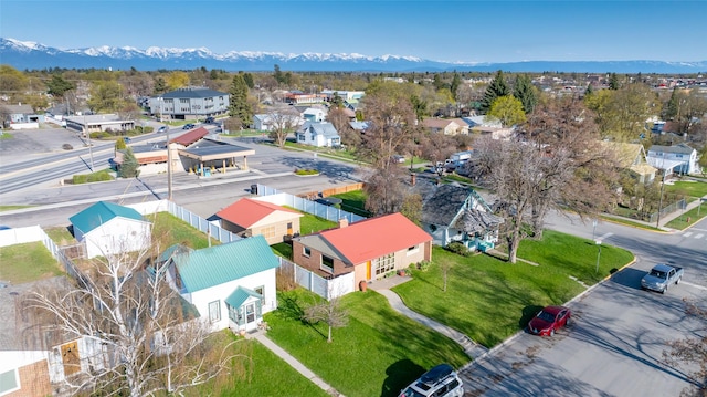 birds eye view of property with a mountain view and a residential view