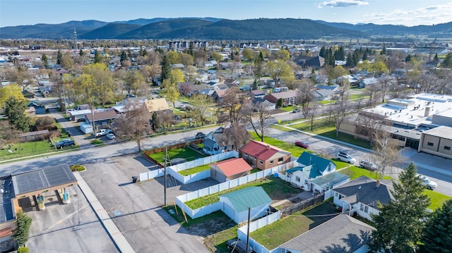 birds eye view of property featuring a mountain view and a residential view