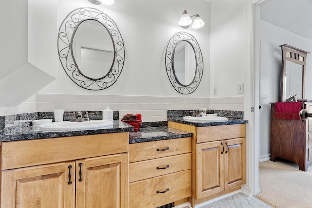bathroom featuring double vanity and a sink