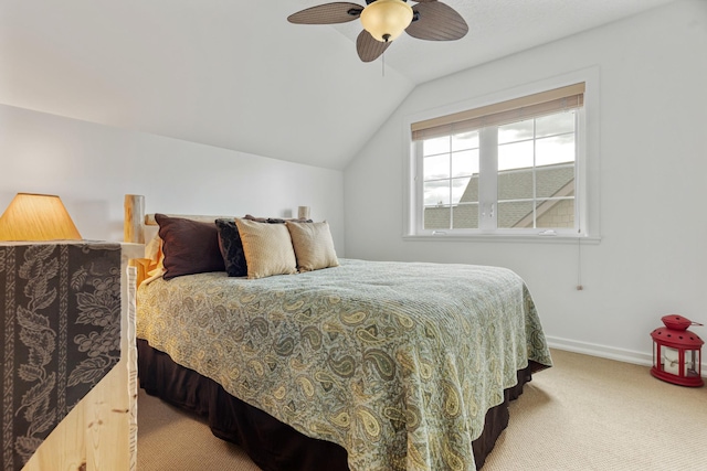 carpeted bedroom with a ceiling fan, lofted ceiling, and baseboards