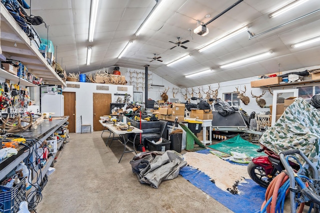 garage with a workshop area and a garage door opener
