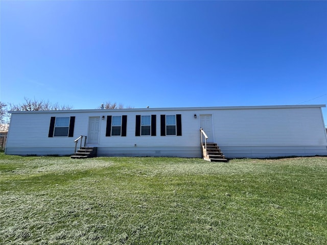 1340 Willow Glen Dr Unit 23, Kalispell, MT 59901 - back of house with entry steps and a yard