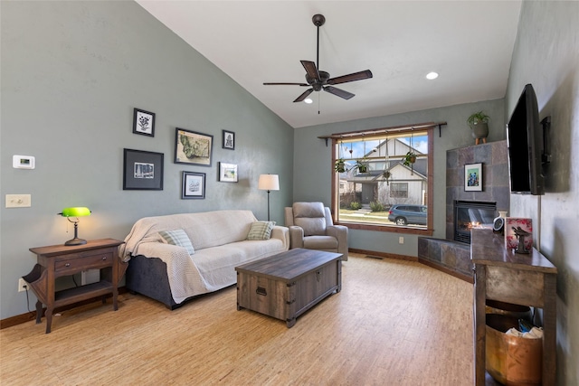 3383 Sora Way, Bozeman, MT 59718 - living area featuring lofted ceiling, a ceiling fan, light wood-type flooring, a fireplace, and recessed lighting