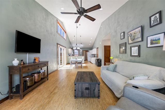 3383 Sora Way, Bozeman, MT 59718 - living room with light wood-type flooring, ceiling fan, high vaulted ceiling, and recessed lighting