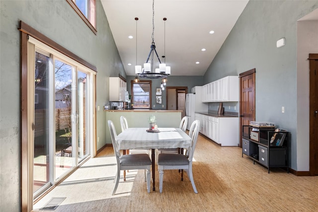 3383 Sora Way, Bozeman, MT 59718 - dining room with high vaulted ceiling, a chandelier, and recessed lighting