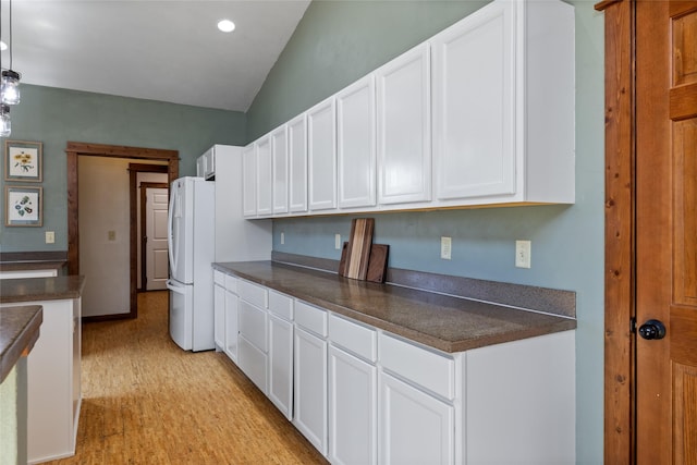 3383 Sora Way, Bozeman, MT 59718 - kitchen with freestanding refrigerator, dark countertops, white cabinetry, and recessed lighting