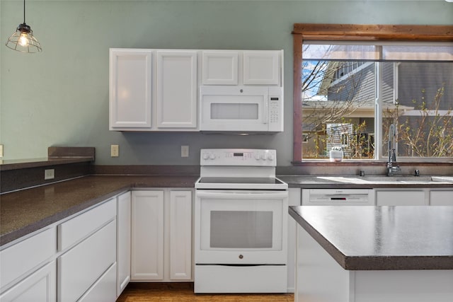 3383 Sora Way, Bozeman, MT 59718 - kitchen with white appliances, white cabinets, and dark countertops