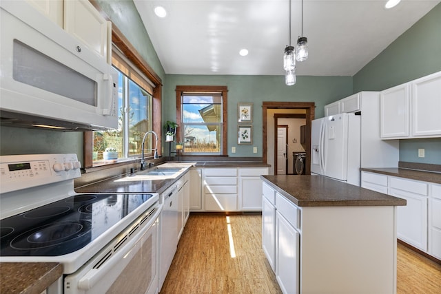 3383 Sora Way, Bozeman, MT 59718 - kitchen featuring white appliances, washing machine and dryer, light wood finished floors, dark countertops, and recessed lighting