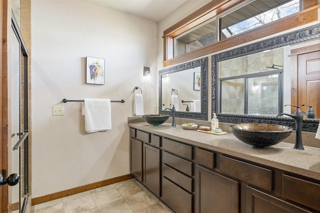 3383 Sora Way, Bozeman, MT 59718 - bathroom featuring double vanity, a stall shower, and tile patterned floors