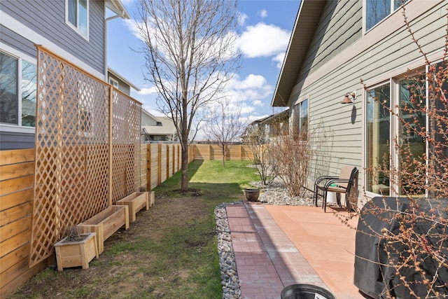 3383 Sora Way, Bozeman, MT 59718 - fenced backyard featuring a patio area