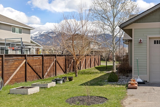 3383 Sora Way, Bozeman, MT 59718 - view of yard featuring a mountain view and a vegetable garden