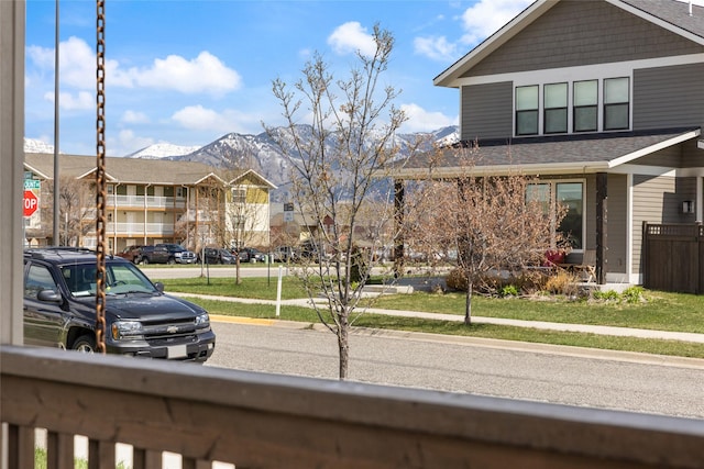 3383 Sora Way, Bozeman, MT 59718 - view of front of home featuring a mountain view, a residential view, a front lawn, and a shingled roof