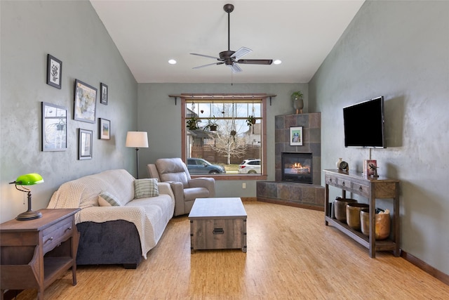 3383 Sora Way, Bozeman, MT 59718 - living area with wood finished floors, a ceiling fan, lofted ceiling, a fireplace, and recessed lighting