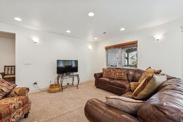 carpeted living area featuring visible vents, recessed lighting, and baseboards
