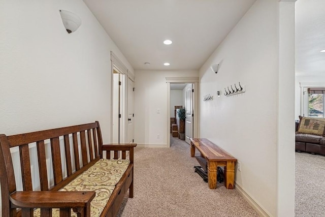 hall featuring recessed lighting, carpet floors, and baseboards