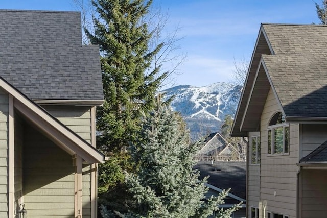 view of side of property with a mountain view