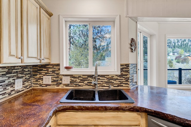 390 Dairy Ln, Superior, MT 59872 - kitchen with a sink, dark countertops, tasteful backsplash, and plenty of natural light