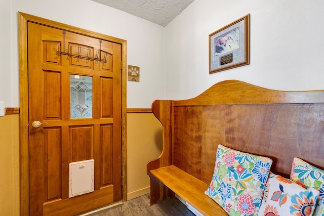 390 Dairy Ln, Superior, MT 59872 - sitting room featuring wood finished floors, a textured ceiling, and baseboards