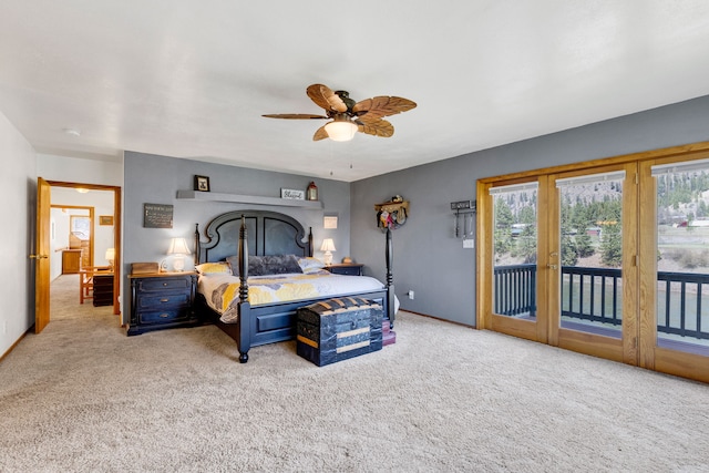 390 Dairy Ln, Superior, MT 59872 - carpeted bedroom with access to outside, multiple windows, ceiling fan, and french doors