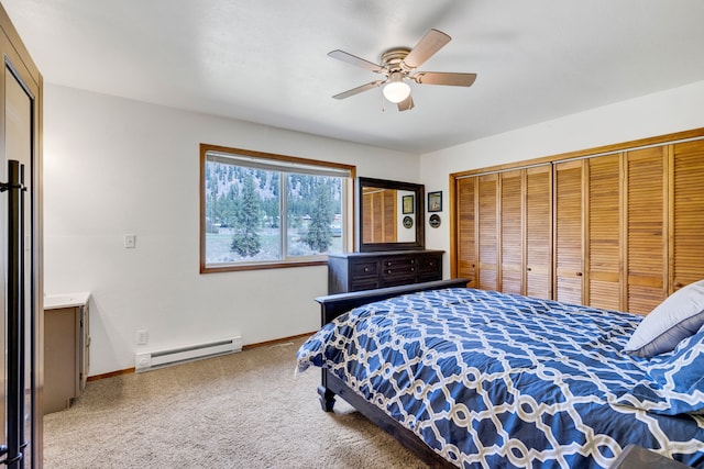 390 Dairy Ln, Superior, MT 59872 - bedroom with a baseboard radiator, carpet flooring, baseboards, a ceiling fan, and a closet