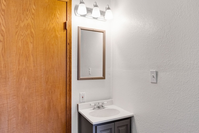 390 Dairy Ln, Superior, MT 59872 - bathroom featuring vanity and a textured wall