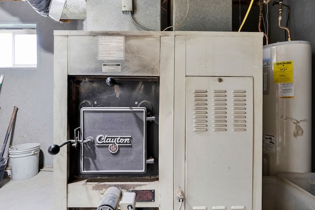 390 Dairy Ln, Superior, MT 59872 - utility room featuring electric water heater
