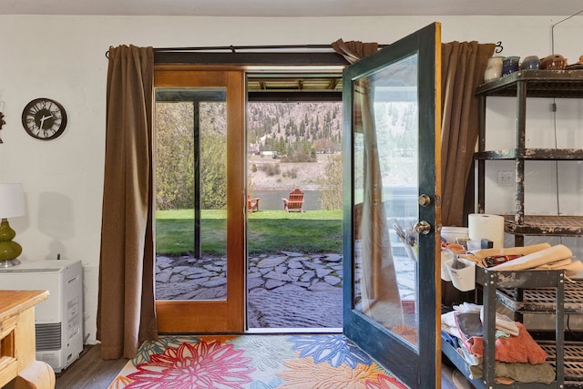390 Dairy Ln, Superior, MT 59872 - doorway to outside featuring plenty of natural light and wood finished floors