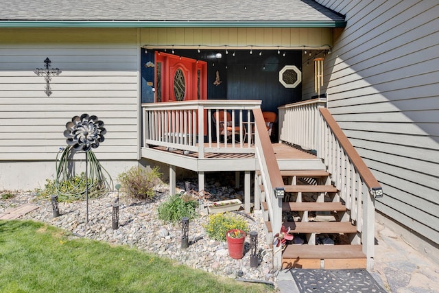 390 Dairy Ln, Superior, MT 59872 - entrance to property with a shingled roof and a wooden deck