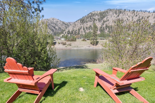 390 Dairy Ln, Superior, MT 59872 - view of grassy yard with a water and mountain view
