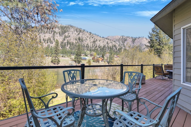 390 Dairy Ln, Superior, MT 59872 - deck featuring outdoor dining space and a mountain view