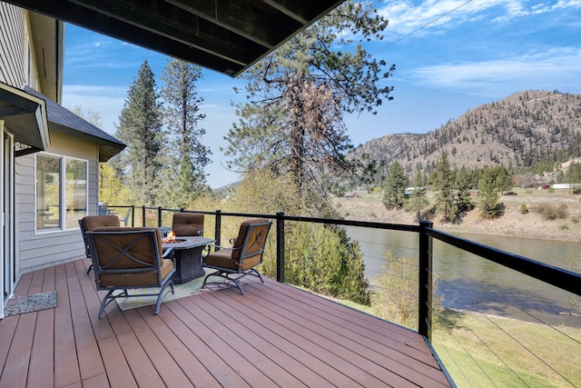 390 Dairy Ln, Superior, MT 59872 - deck with a mountain view and an outdoor fire pit