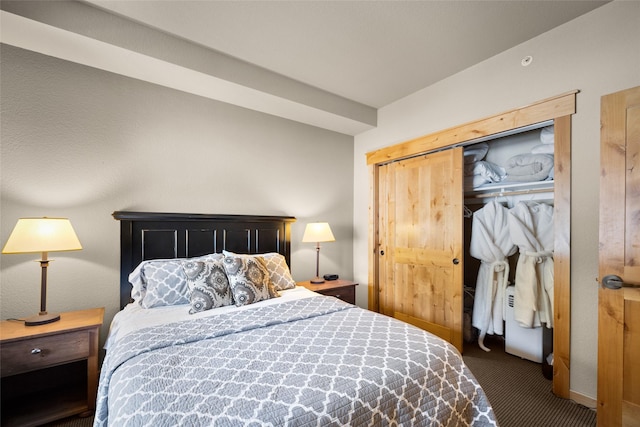 carpeted bedroom featuring a closet