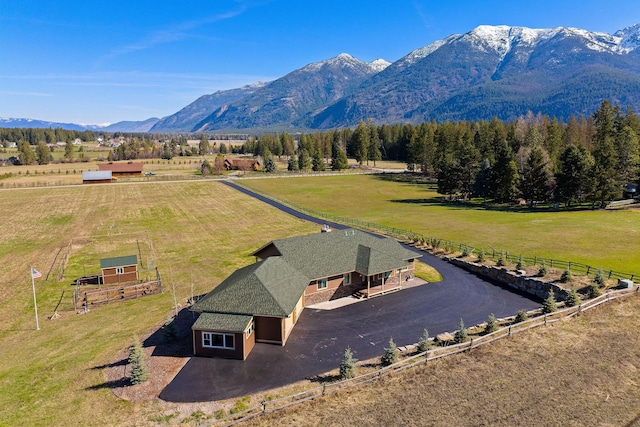 bird's eye view featuring a mountain view and a rural view