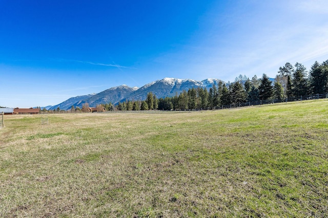 mountain view featuring a rural view