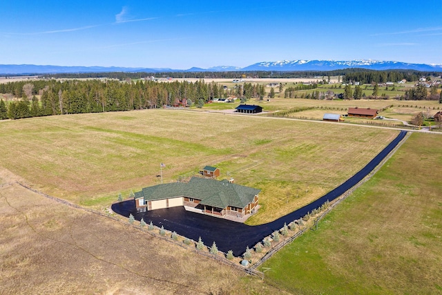 birds eye view of property featuring a mountain view and a rural view