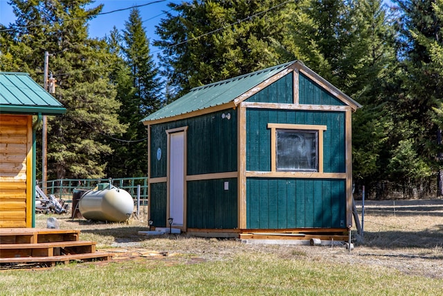 view of shed featuring fence