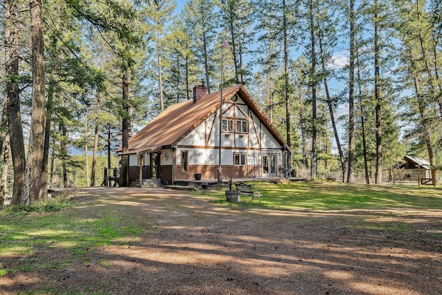 rear view of property with a chimney