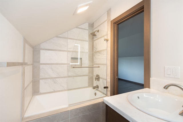 bathroom featuring vanity and tiled shower / bath combo