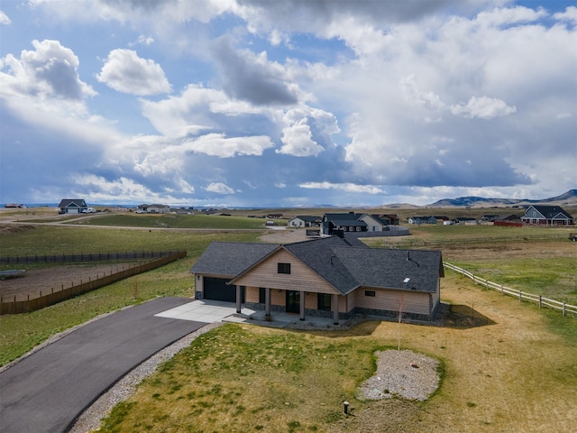 birds eye view of property with a rural view