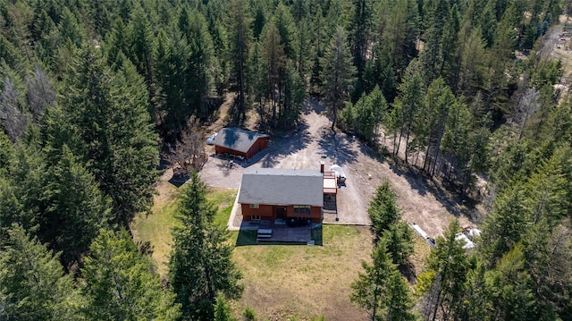 aerial view featuring a wooded view