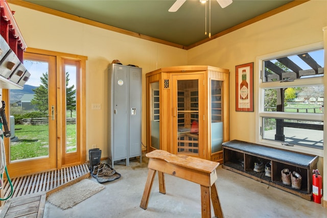 office with concrete floors, a ceiling fan, and a healthy amount of sunlight