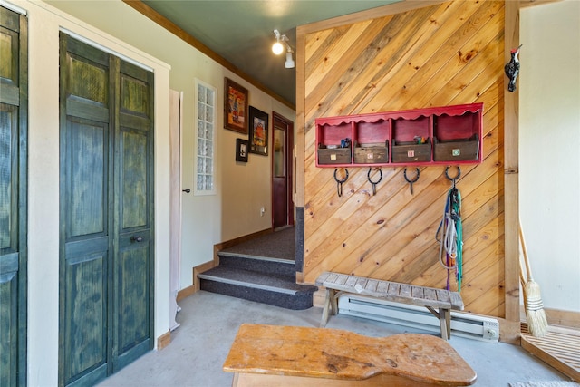 7850 Stegner Dr, Missoula, MT 59808 - mudroom featuring baseboard heating, concrete floors, and wood walls