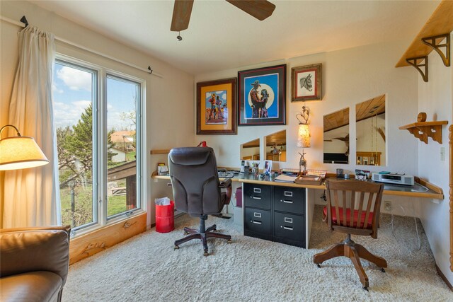 office area with a wealth of natural light, ceiling fan, and carpet floors