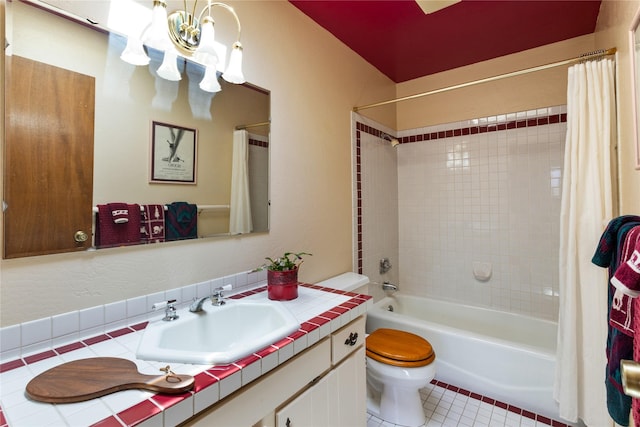 bathroom with tile patterned flooring, shower / bath combo, toilet, vanity, and a notable chandelier