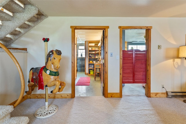 interior space featuring baseboard heating and baseboards