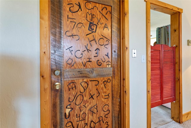 room details featuring baseboards and carpet flooring