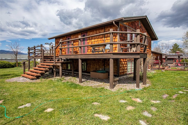 7850 Stegner Dr, Missoula, MT 59808 - rear view of house with stairs, a wooden deck, and a lawn